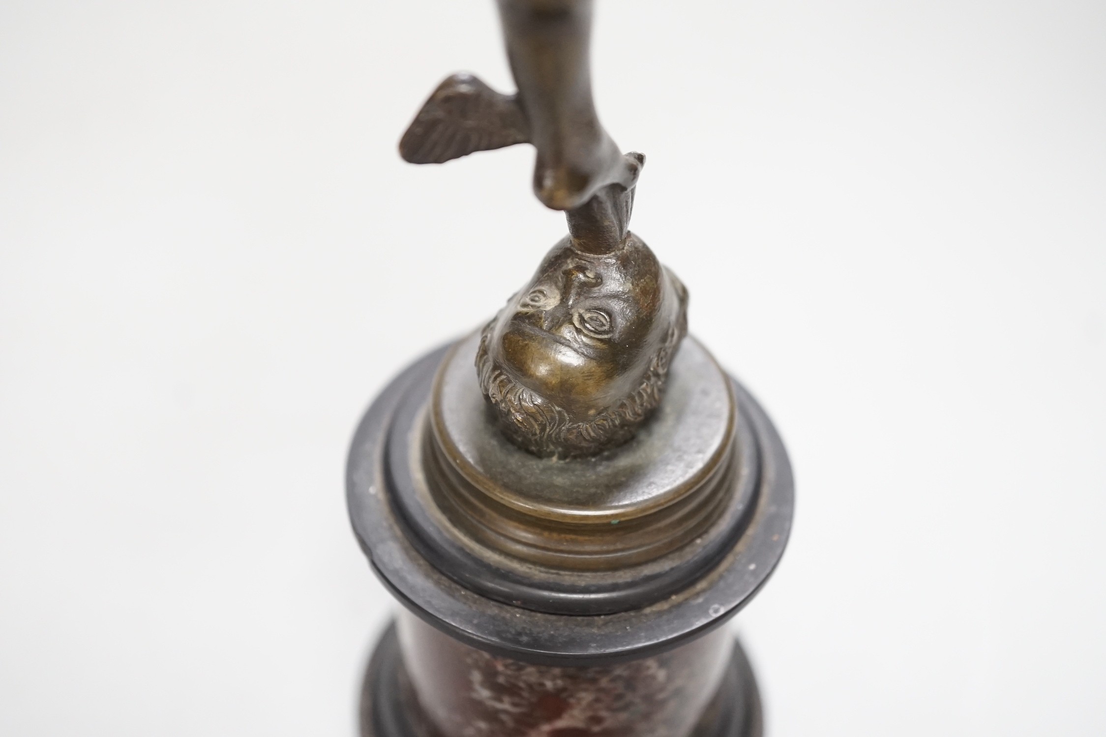 A bronze figure of Mercury on a graduated marble plinth. 33cm tall